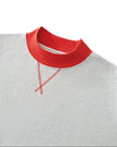 Close-up of the red ribbed neckline and stitched V-detail on the flower gray Athlesi TrackLine Heritage Sweatshirt