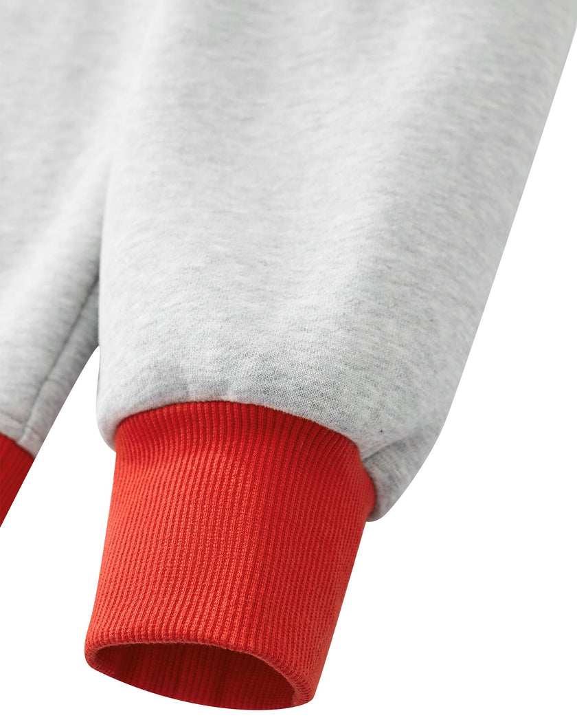 Close-up of the red ribbed sleeve cuff on the flower gray Athlesi TrackLine Heritage Sweatshirt