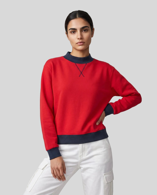 Model wearing the Athlesi TrackLine Heritage Sweatshirt in red with navy blue contrast trim, front view