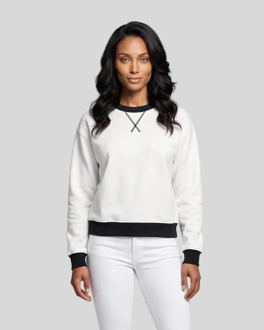 Model wearing the Athlesi TrackLine Heritage Sweatshirt in white with black contrast trim, front view