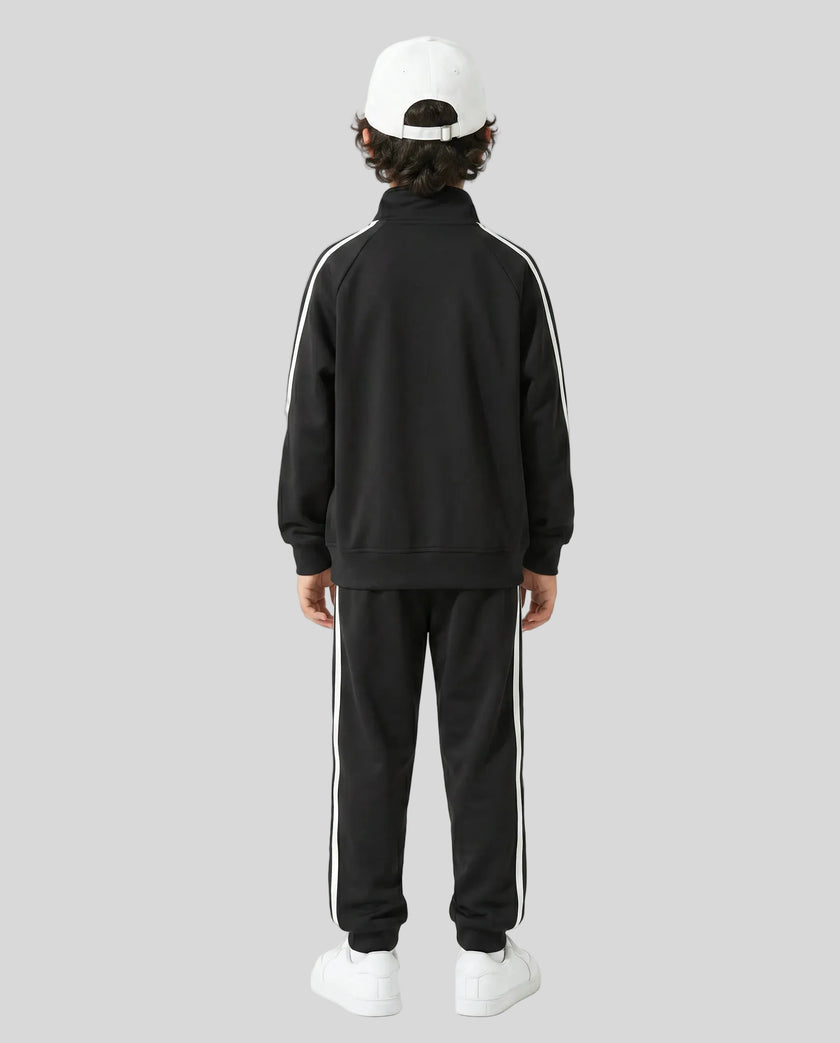 Back view of a child wearing the TrackLine Junior Club Jacket in Black