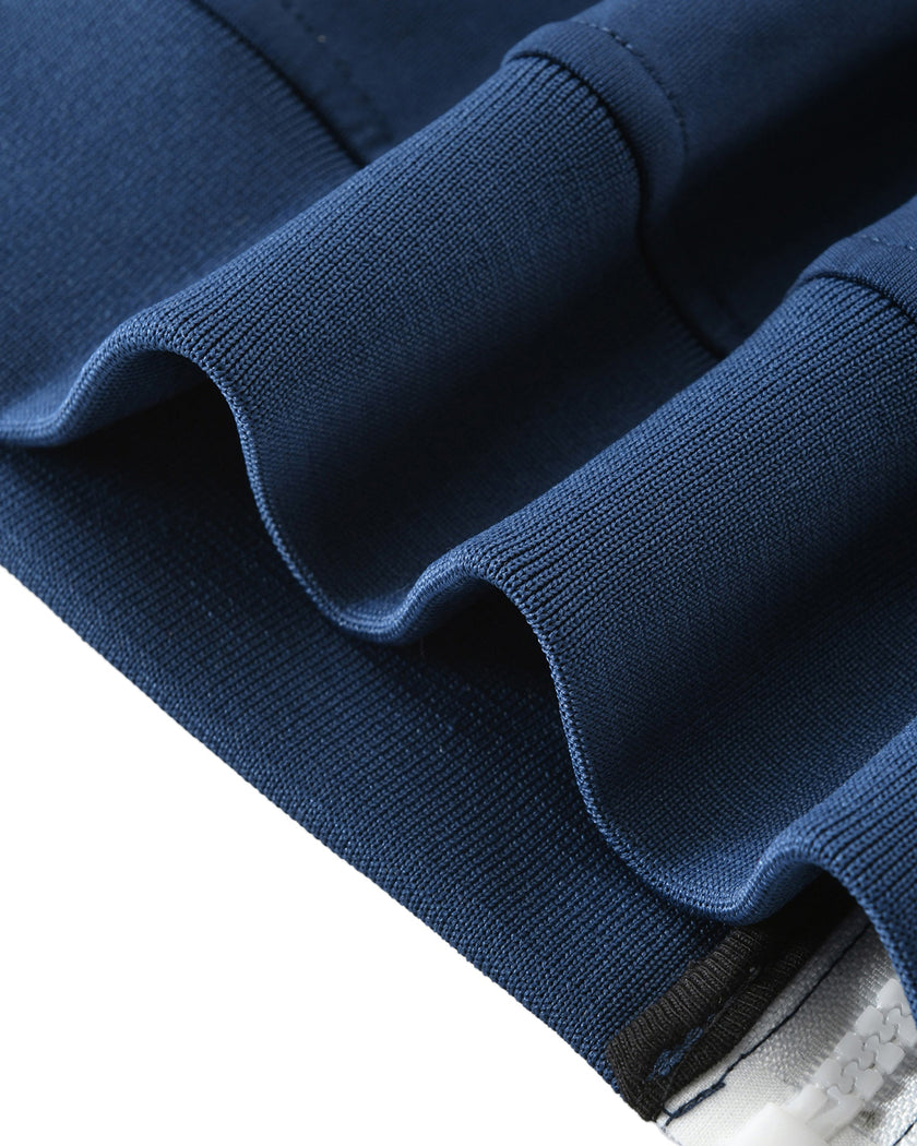 Zipper and hem detail on the TrackLine Junior Club Jacket in Royal Blue