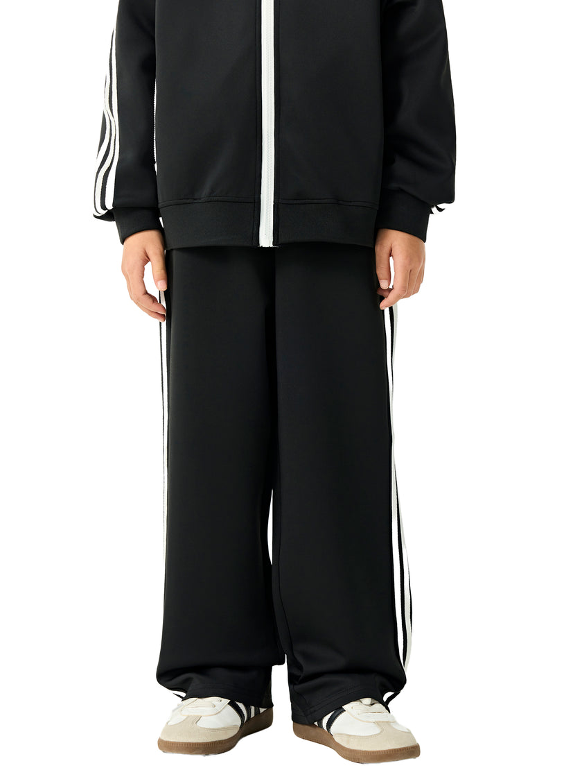 Child wearing the TrackLine Junior Club Pants in Black front view