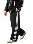 Side view of a child wearing the TrackLine Junior Club Pants in Black