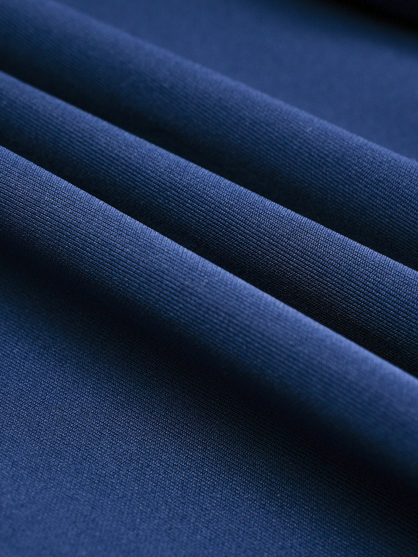 Soft stretch performance fabric detail on the TrackLine Junior Club Pants in Royal Blue