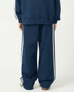 Back view of a child wearing the TrackLine Junior Club Pants in Royal Blue