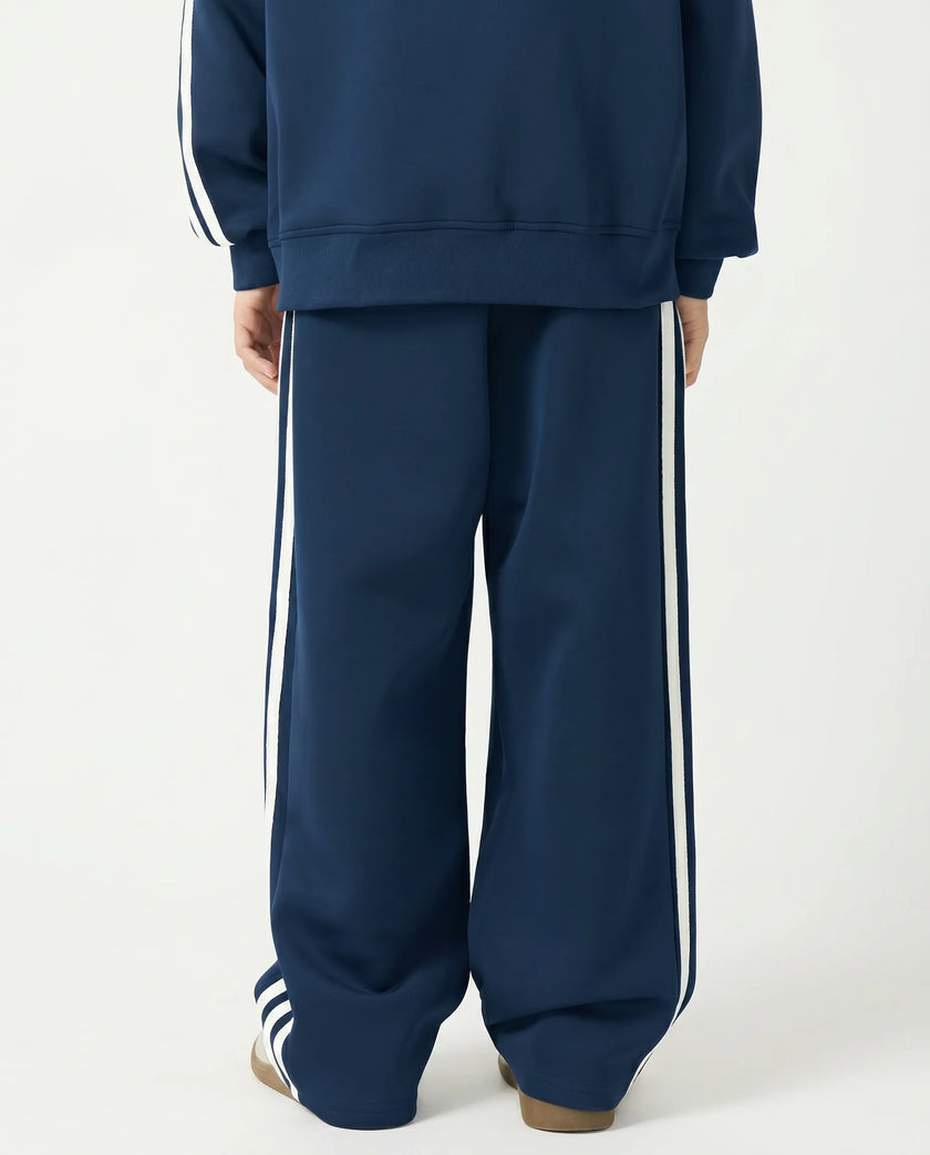 Back view of a child wearing the TrackLine Junior Club Pants in Royal Blue