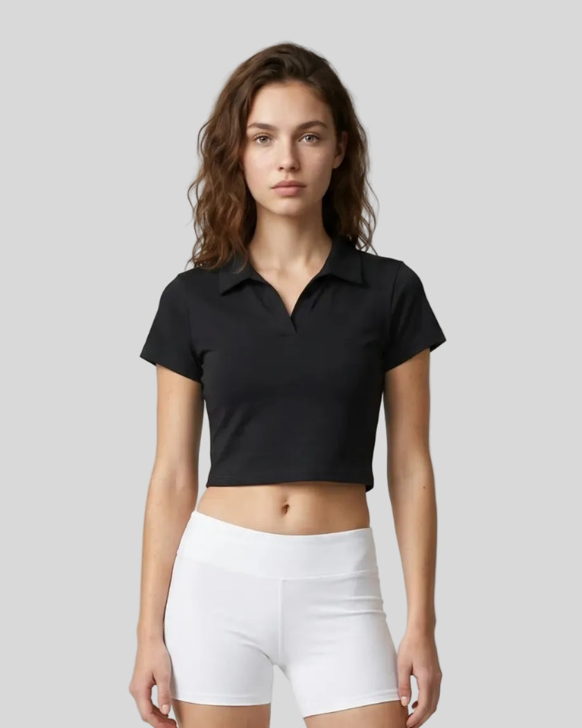 Upper body front view of a woman wearing the Athlesi TrackLine Lapel Crop Top in black