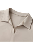 Front collar closeup of the Athlesi TrackLine Lapel Crop Top in light coffee