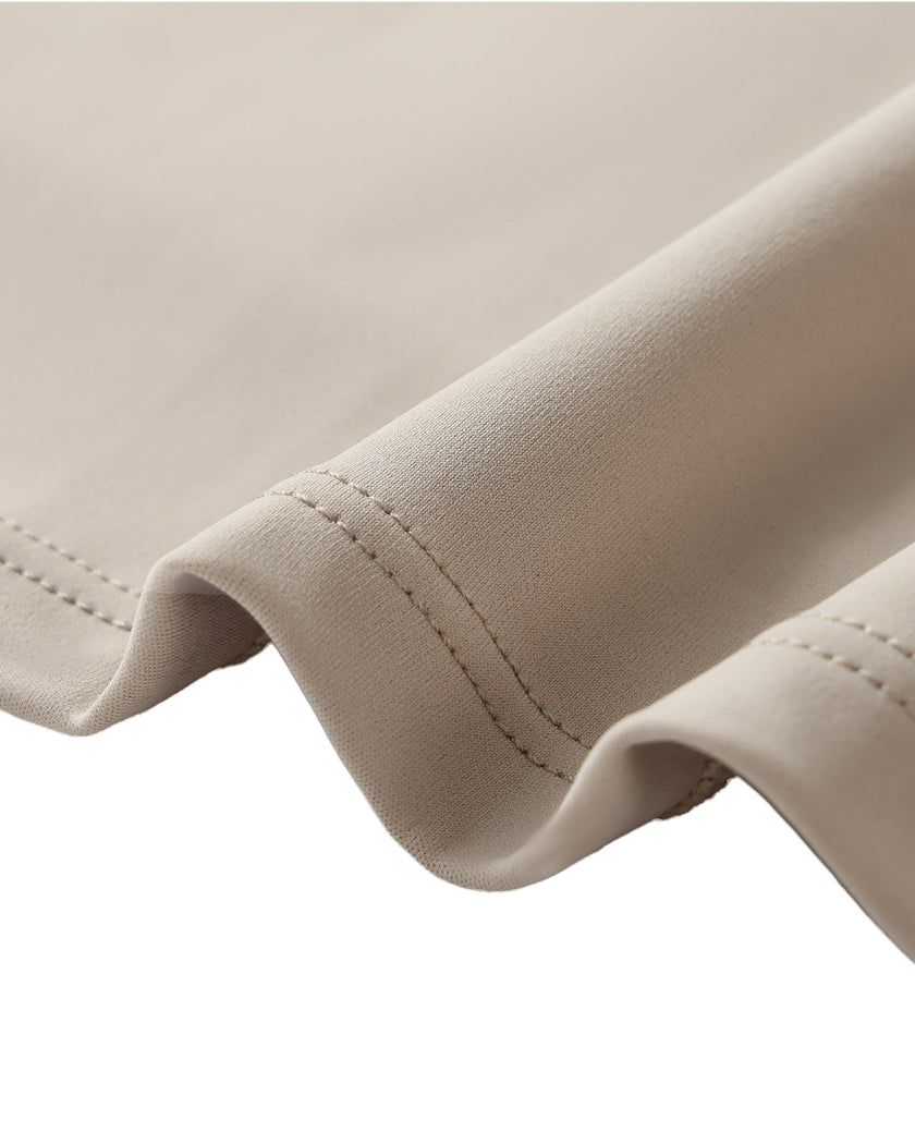 Closeup of the smooth stretch fabric on the Athlesi TrackLine Lapel Crop Top in light coffee