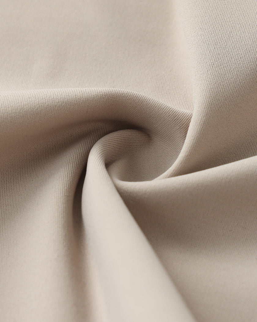 Detailed fabric texture closeup of the Athlesi TrackLine Lapel Crop Top in light coffee