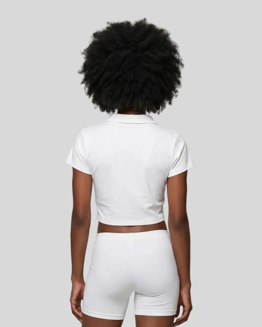 Lower body back styling view featuring the Athlesi TrackLine Lapel Crop Top in white
