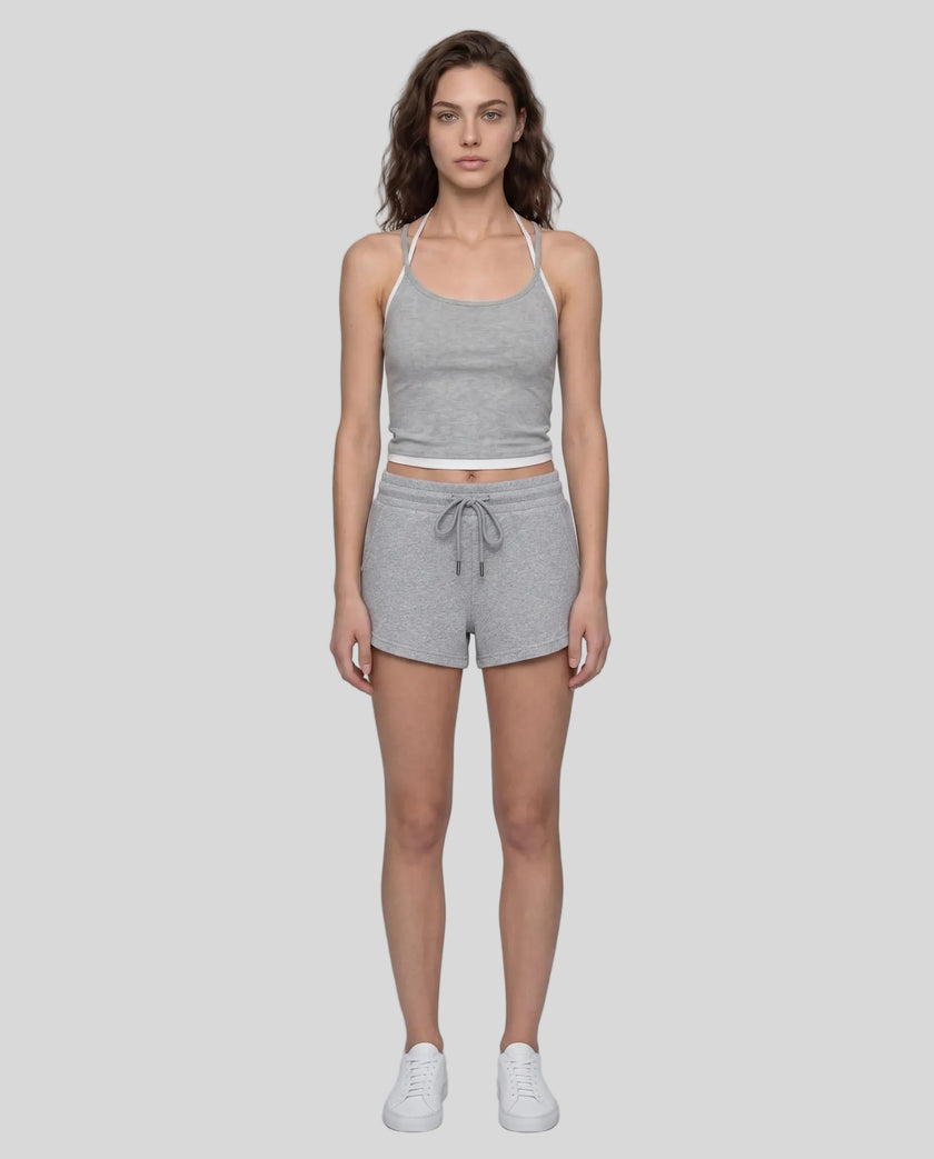 Model wearing TrackLine Lounge Halter Tank in flower gray and white with Trackline Lounge Shorts in flower gray front view