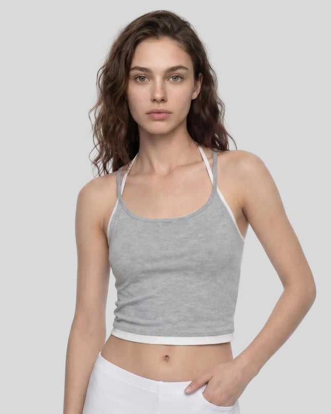 Angled front view of model wearing TrackLine Lounge Halter Tank in flower gray
