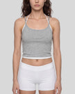 Model wearing TrackLine Lounge Halter Tank in flower gray and white front view