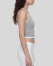 Side profile of model wearing TrackLine Lounge Halter Tank with halter strap detail