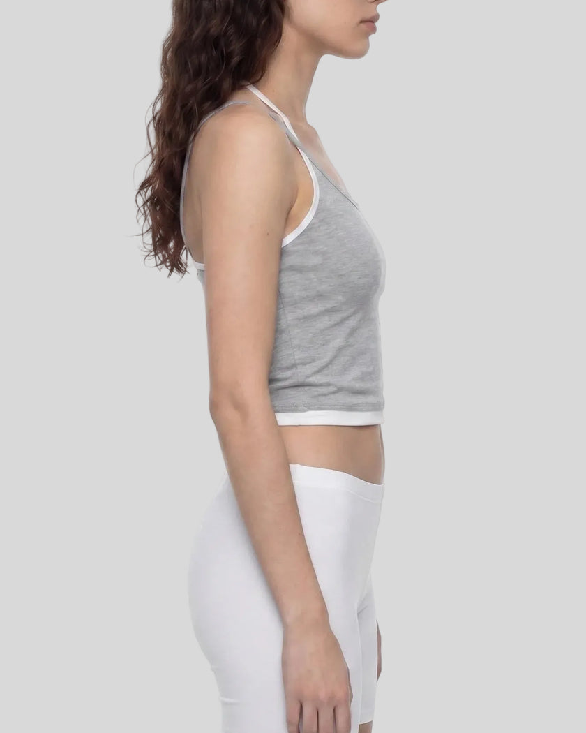 Side profile of model wearing TrackLine Lounge Halter Tank with halter strap detail