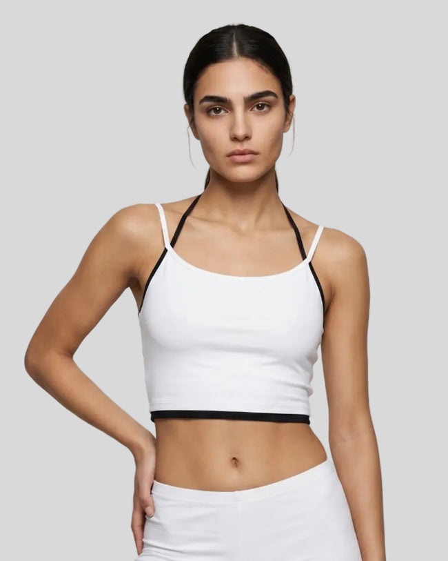 Model wearing TrackLine Lounge Halter Tank in flower white and black front view