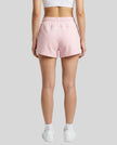 Back view of model wearing TrackLine Lounge Shorts in pink