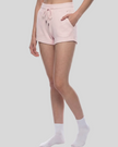 Angled front view of model wearing TrackLine Lounge Shorts in pink