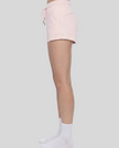 Side profile of model wearing TrackLine Lounge Shorts with relaxed fit