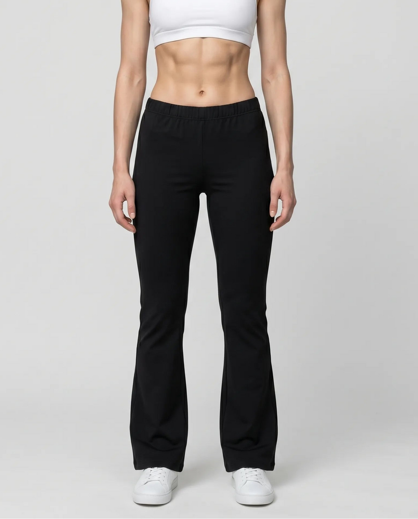 Woman wearing TrackLine Lounge Sweatpants in black front view with relaxed flared silhouette