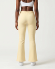 Back view of TrackLine Lounge Sweatpants in light apricot with relaxed lounge silhouette