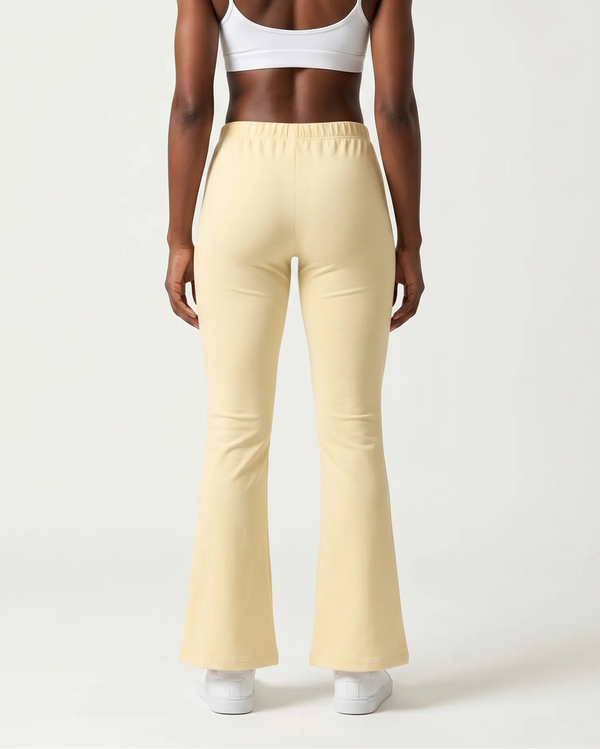 Back view of TrackLine Lounge Sweatpants in light apricot with relaxed lounge silhouette