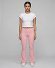 Full body front view of TrackLine Lounge Sweatpants in pink and Trackline Lounge Tee in white