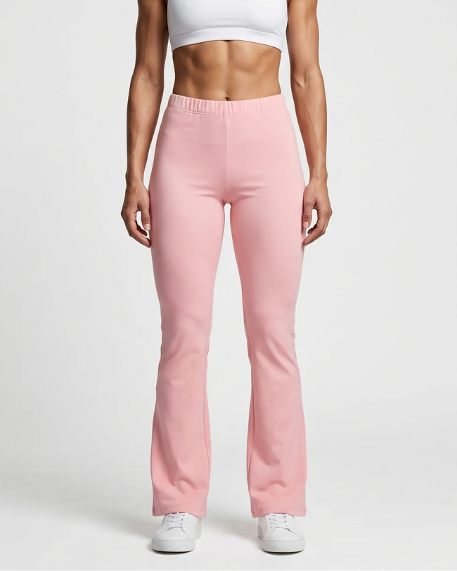 Woman wearing TrackLine Lounge Sweatpants in pink front view with relaxed flared silhouette