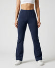 Woman wearing TrackLine Lounge Sweatpants in royal blue front view with relaxed flared silhouette