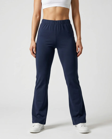 Woman wearing TrackLine Lounge Sweatpants in royal blue front view with relaxed flared silhouette
