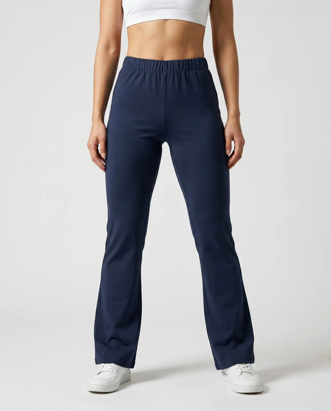 Woman wearing TrackLine Lounge Sweatpants in royal blue front view with relaxed flared silhouette
