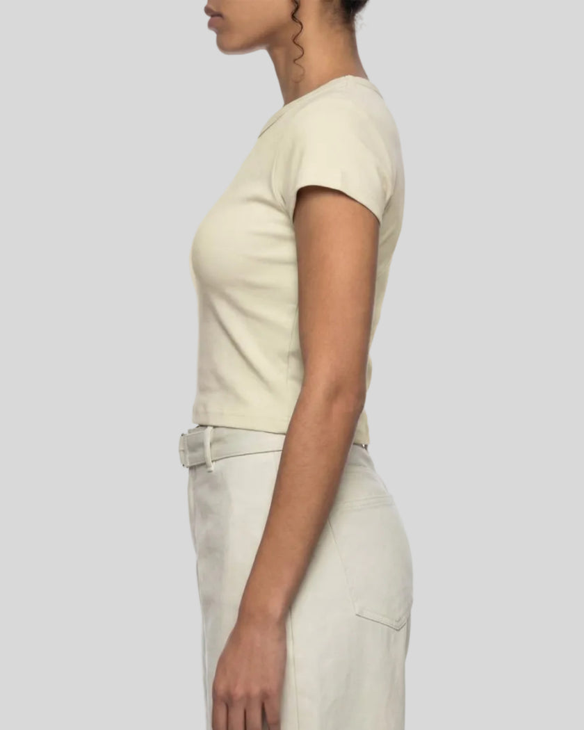 Side profile of model wearing TrackLine Lounge Tee in apricot