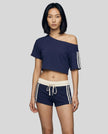 Woman wearing blue Trackline Off-Shoulder Tee paired with blue Trackline Track Shorts