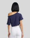 Upper body back view of the Athlesi TrackLine Off-Shoulder Tee in blue