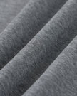 Closeup of the heavyweight cotton blend fabric texture on the Athlesi TrackLine Off-Shoulder Tee in gray