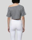 Mid body back view of the Athlesi TrackLine Off-Shoulder Tee in gray