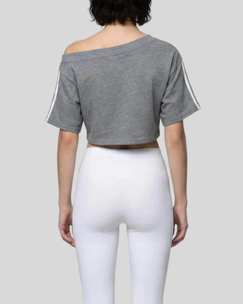 Mid body back view of the Athlesi TrackLine Off-Shoulder Tee in gray