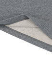 Bottom hem closeup of the Athlesi TrackLine Off-Shoulder Tee in gray