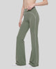 Front angled view of a model wearing the TrackLine Outline Flared Pants in Gray Green