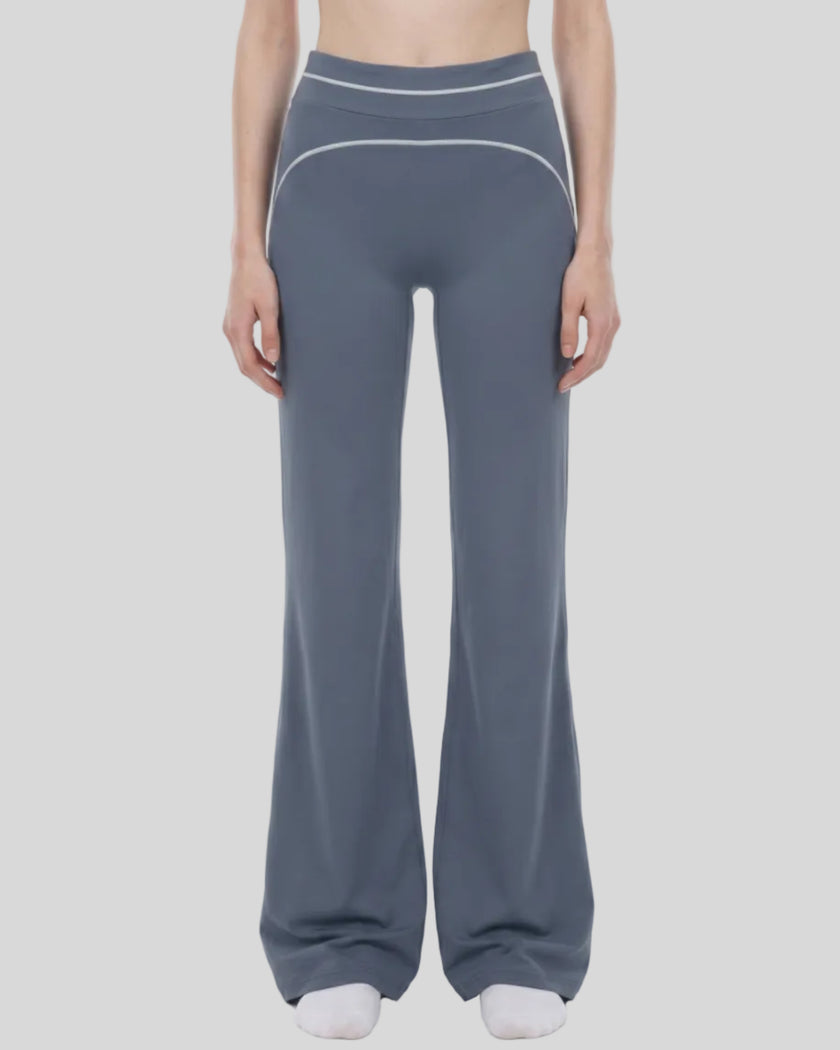 Model wearing the TrackLine Outline Flared Pants in Haze Blue viewed from the front