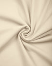 Detailed view of the premium stretch knit fabric and stitching on the TrackLine Outline Flared Pants in Light Apricot