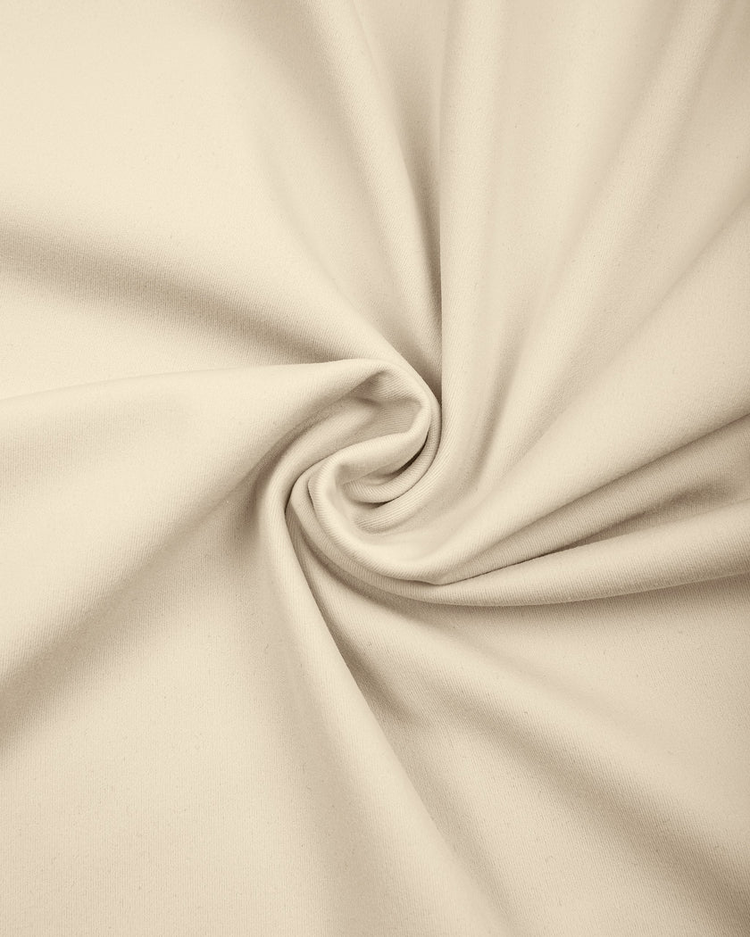 Detailed view of the premium stretch knit fabric and stitching on the TrackLine Outline Flared Pants in Light Apricot