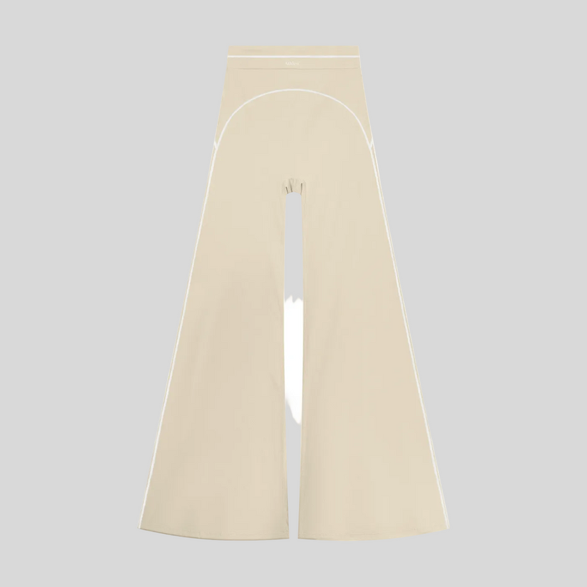 TrackLine Outline Flared Pants in Light Apricot front view featuring a high-rise waistband, contrast piping, and flared leg