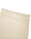 Close-up of the high-rise front waistband on the TrackLine Outline Flared Pants in Light Apricot