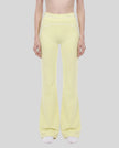 Model wearing the TrackLine Outline Flared Pants in Light Green viewed from the front