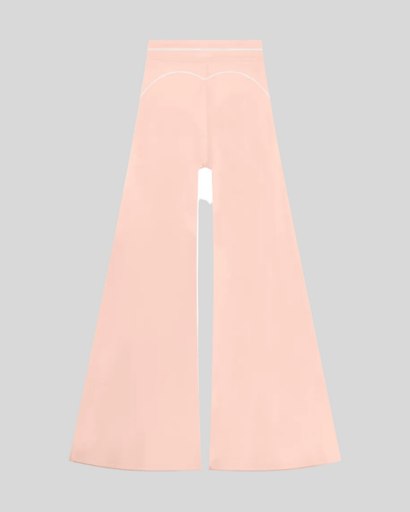 TrackLine Outline Flared Pants in Light Pink back view showcasing the sculpting back seam and flared silhouette