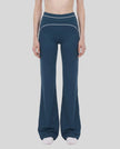 Model wearing the TrackLine Outline Flared Pants in Navy Blue viewed from the front