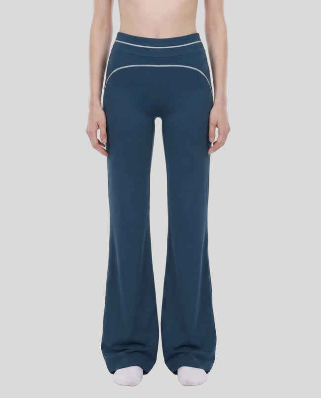Model wearing the TrackLine Outline Flared Pants in Navy Blue viewed from the front